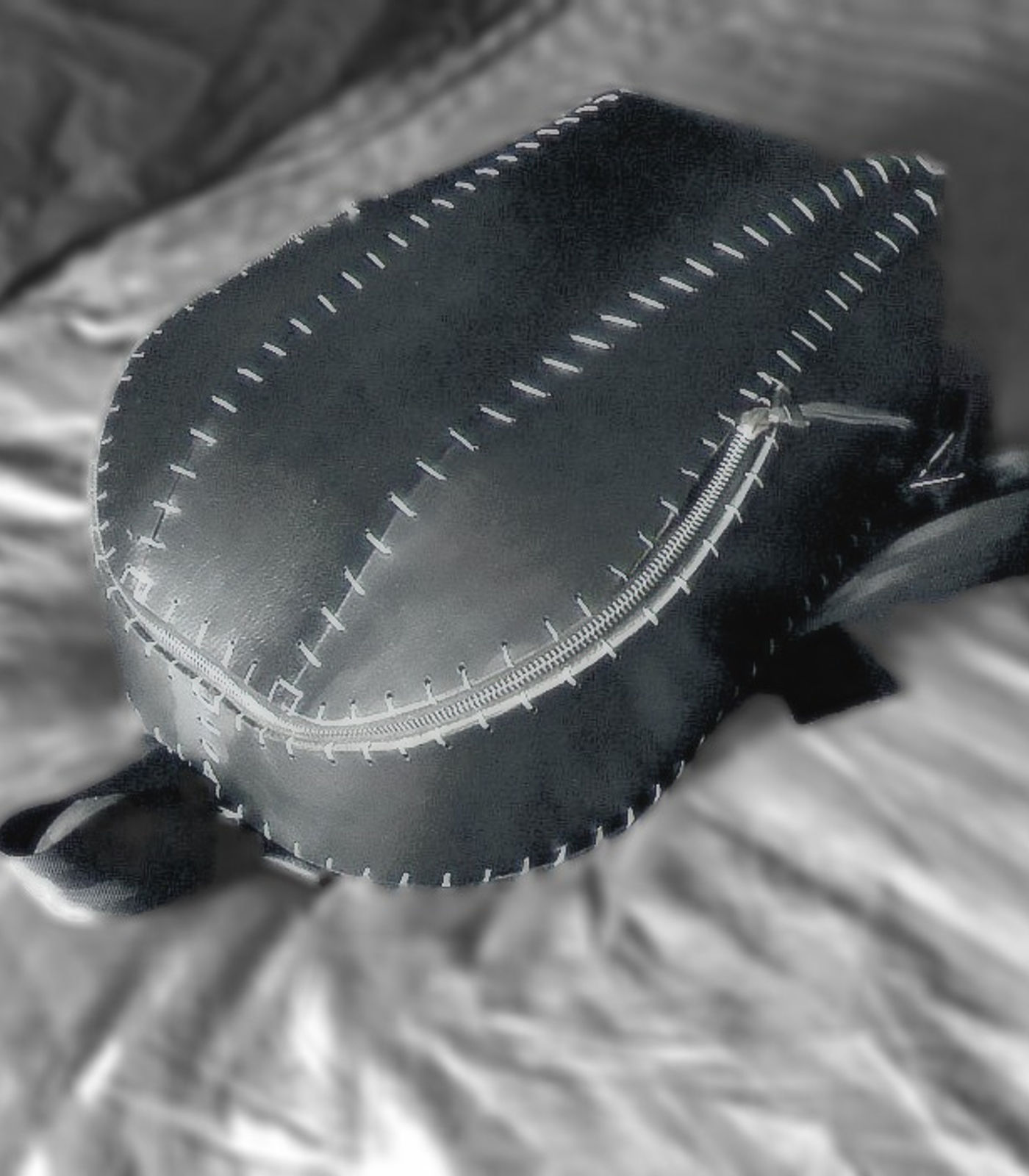 Black leather belt bag with white saddle stitching