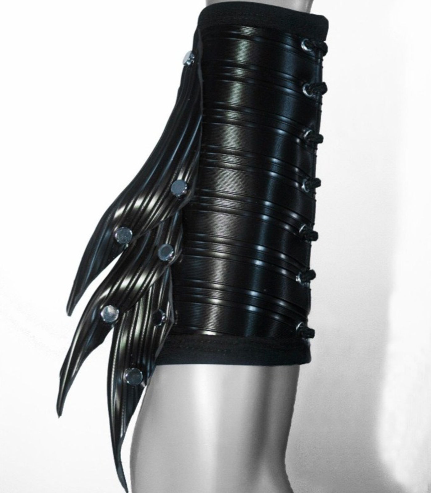 Black ribbed gauntlet with metal studs and flared plates