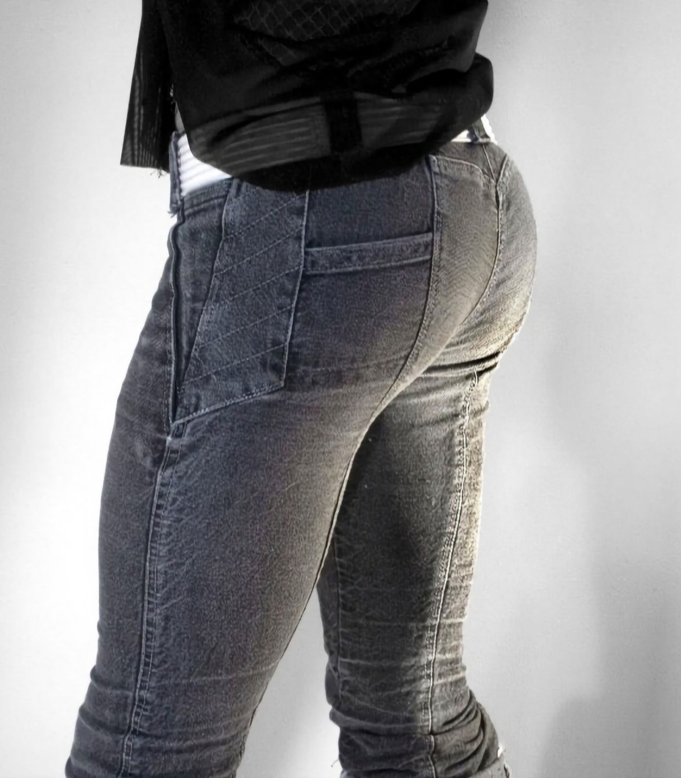 Dark couture denim jeans with angled seam panels