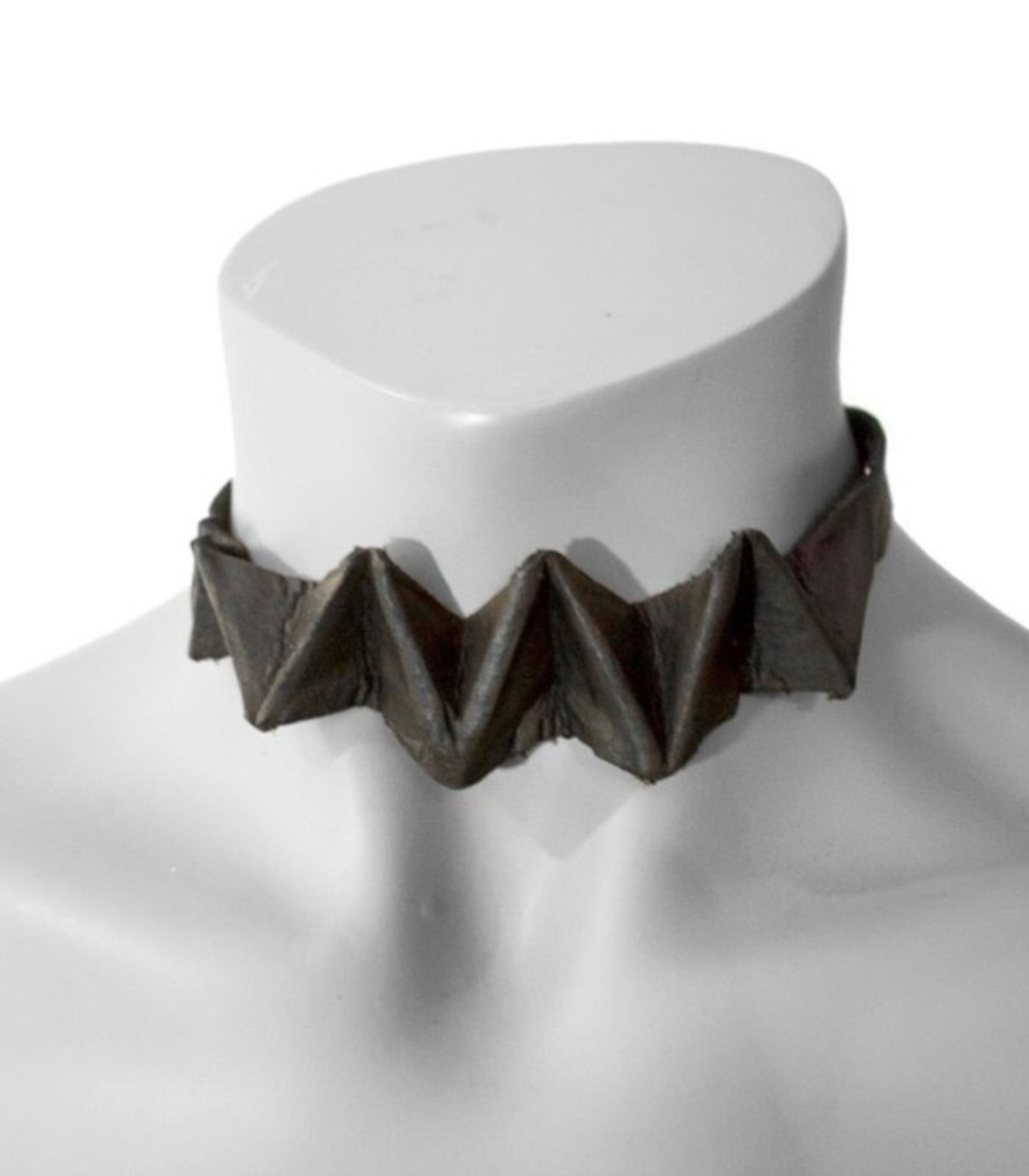 Folded dark leather choker on a white form