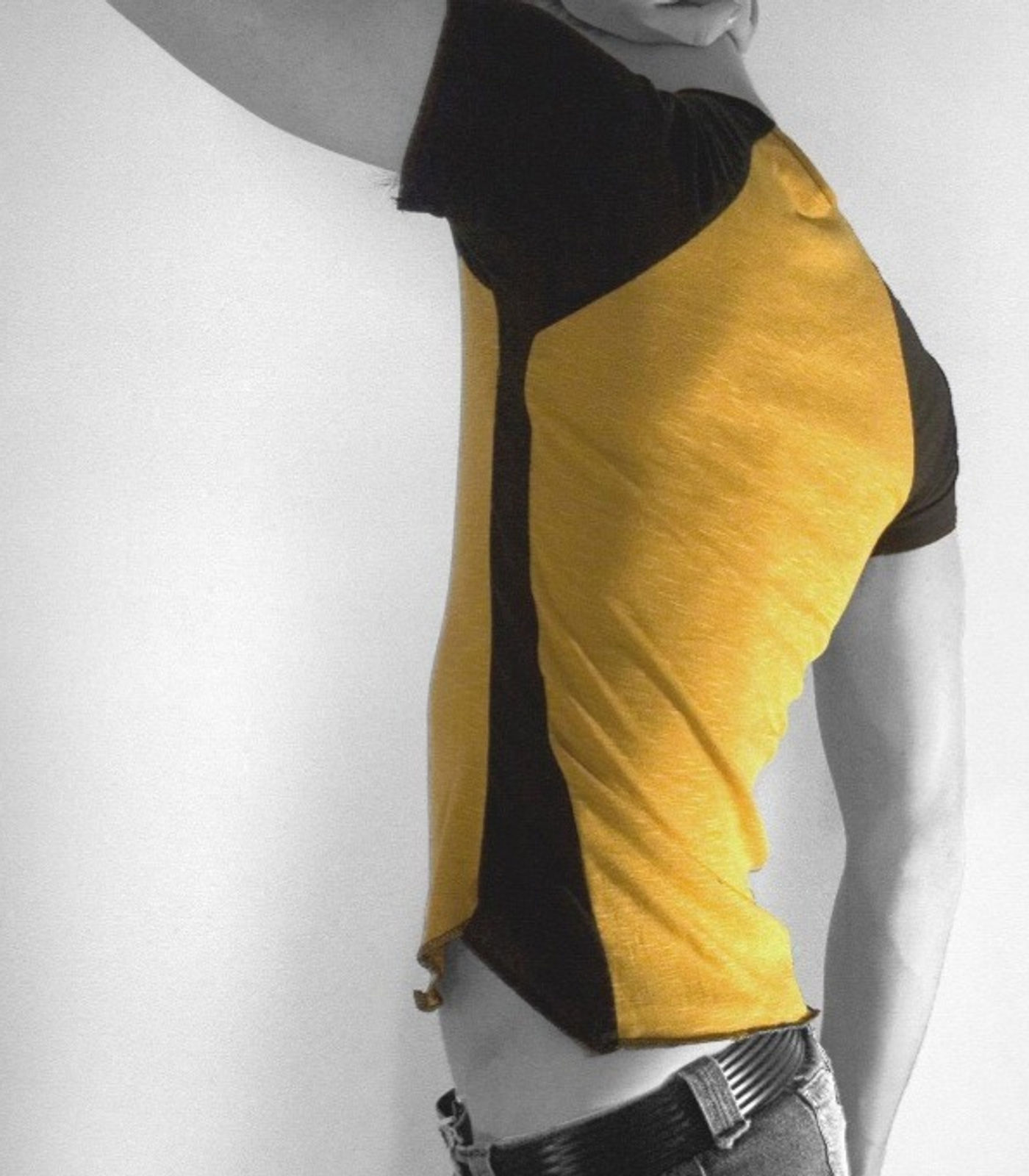 Yellow and black paneled t-shirt, worn